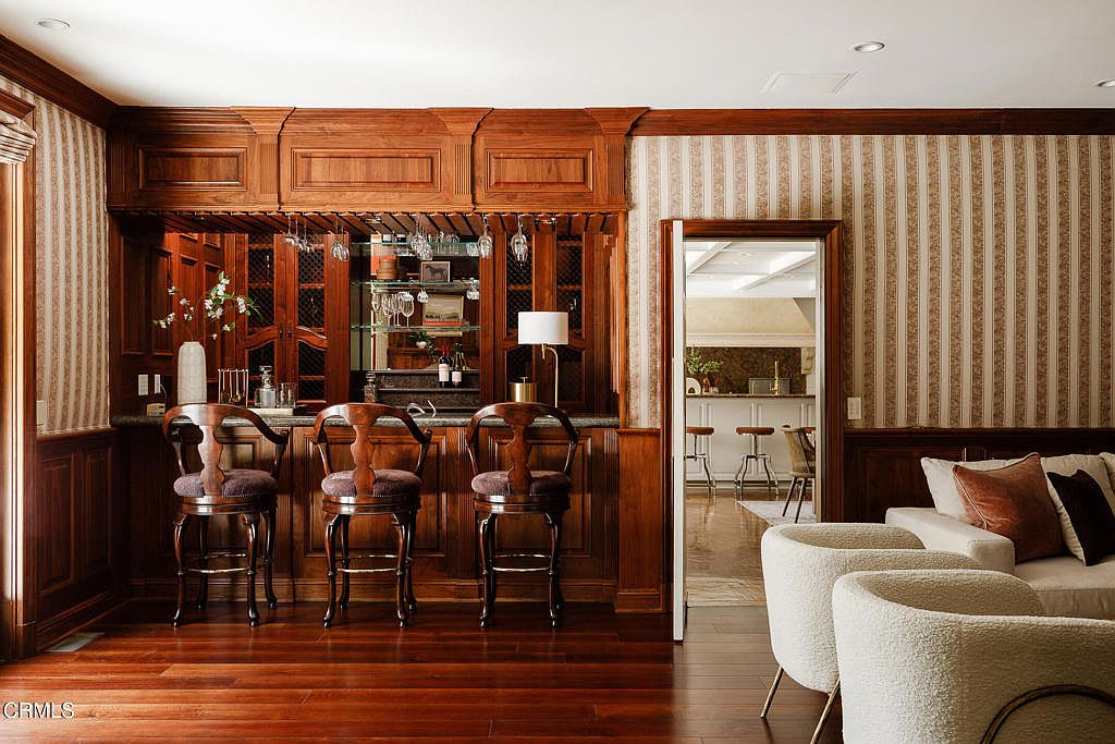 Kitchen with center island and statement fireplace.