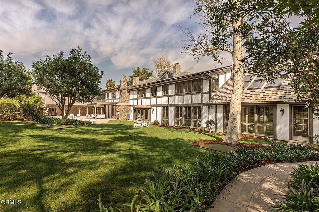 Outdoor pool and landscaped grounds.